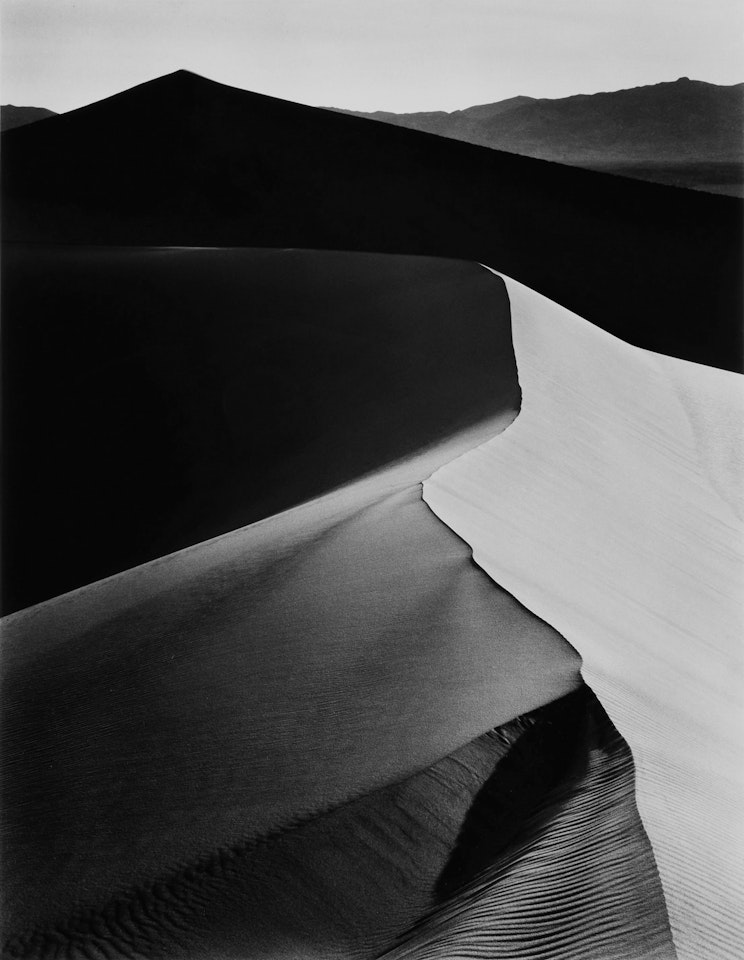 ‘Sand Dune, Sunrise, Death Valley National Monument, California" by Ansel Adams