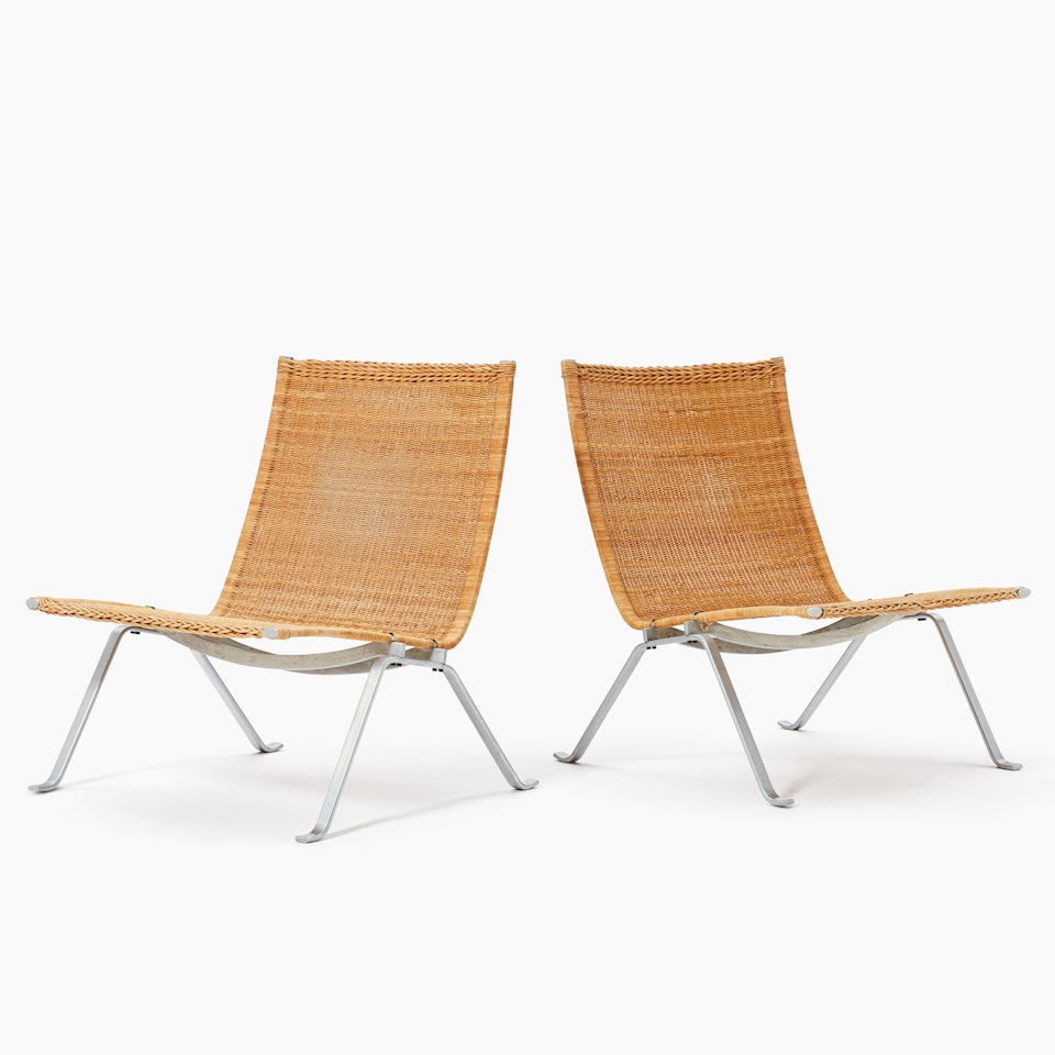 Armchairs, a pair. "PK 22"; A pair of Poul Kjaerholm "PK 22" wicker easy chairs by Poul Kjaerholm
