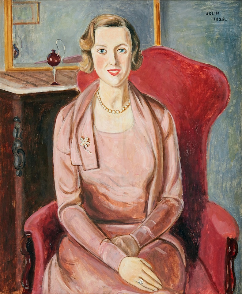 Woman in pink dress sitting in armchair by Einar Jolin