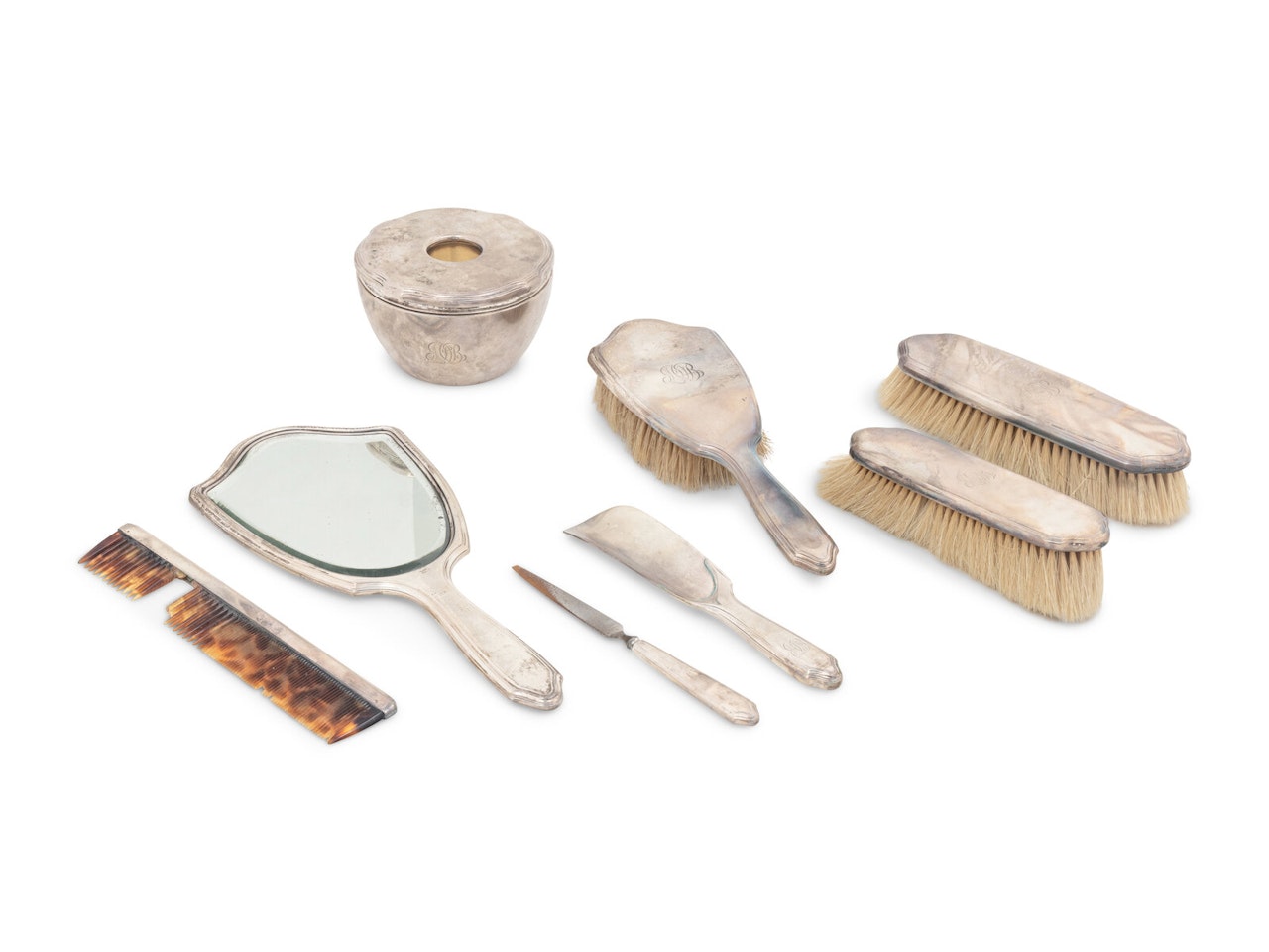 A Tiffany and Co. Silver Eight-Piece Dresser Set by Tiffany & Co.
