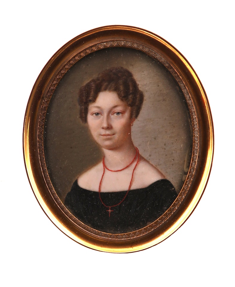 Portrait miniature of Augusta Eleonara von Reutter, wearing a black dress, coral necklace and cross by German School