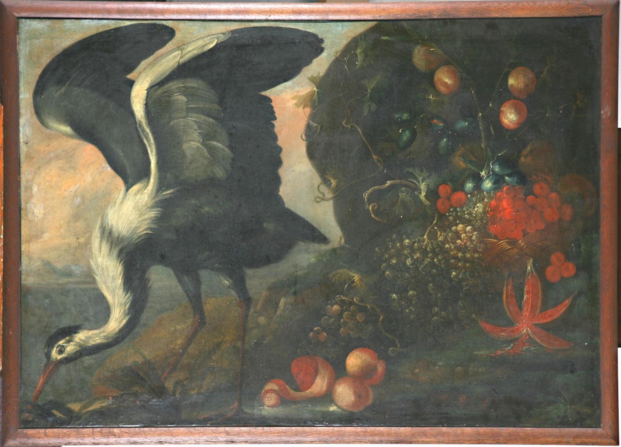 Still life of a basket of fruit in a landscape with a crane; Still life of a vase of flowers in a niche, with a parrot swooping on a bunch of grapes, a hilly landscape with a castle beyond by Italian School