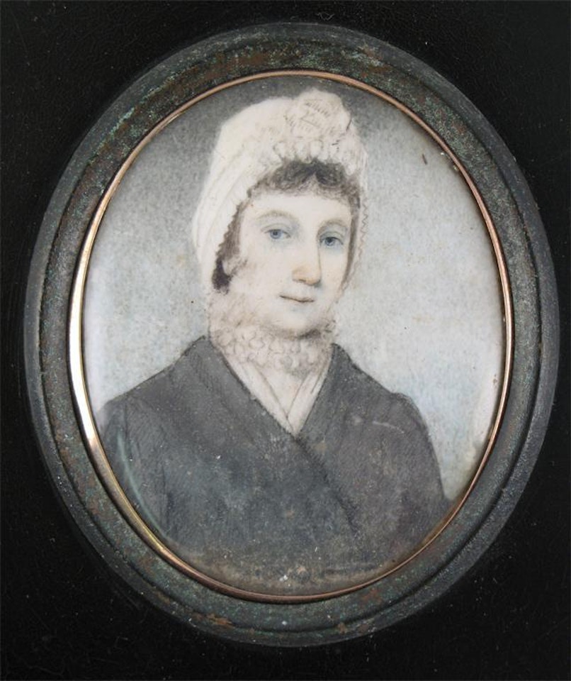 Portrait of a lady in a blue coat and a white bonnet by English School