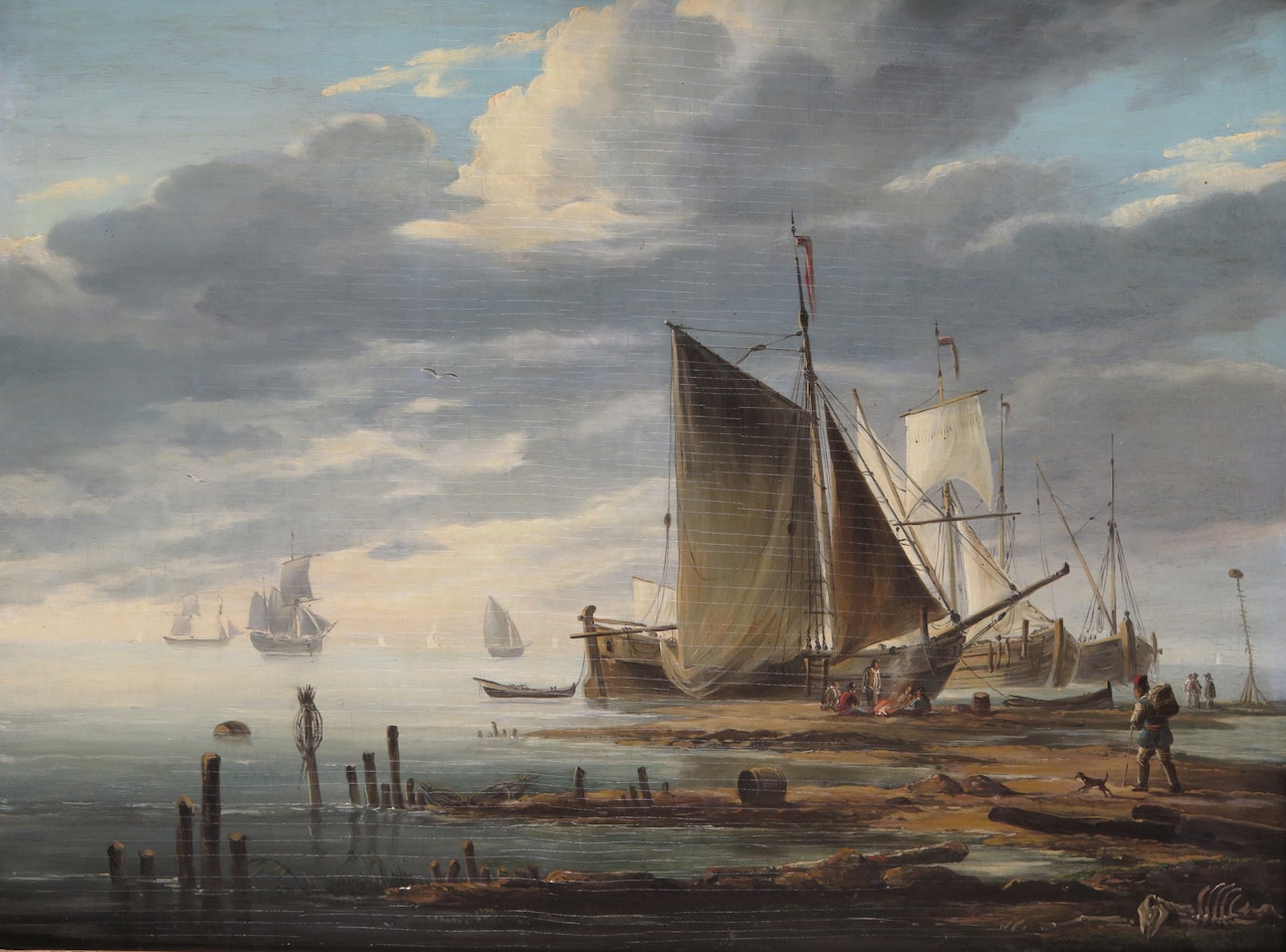 Ships on the shore with fisherfolk resting and a skeleton in the foreground by Dutch School