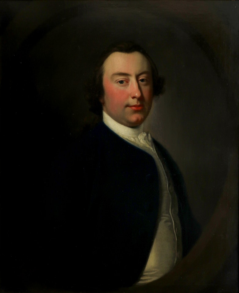Portrait of a gentleman, traditionally identified as Joseph King, wearing a blue jacket and white waistcoat in a painted oval by Thomas Hudson