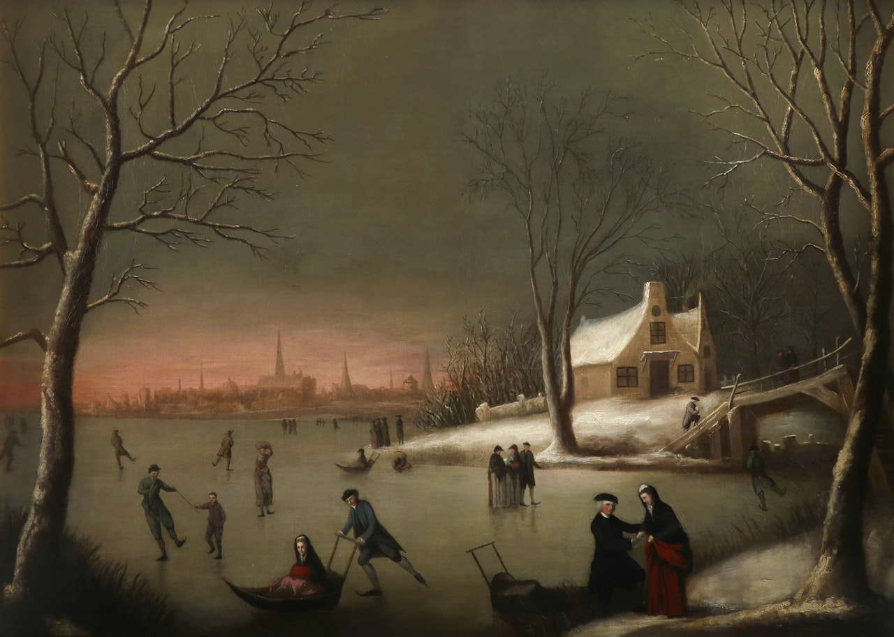 Winter landscape with skaters on a frozen river by Dutch School
