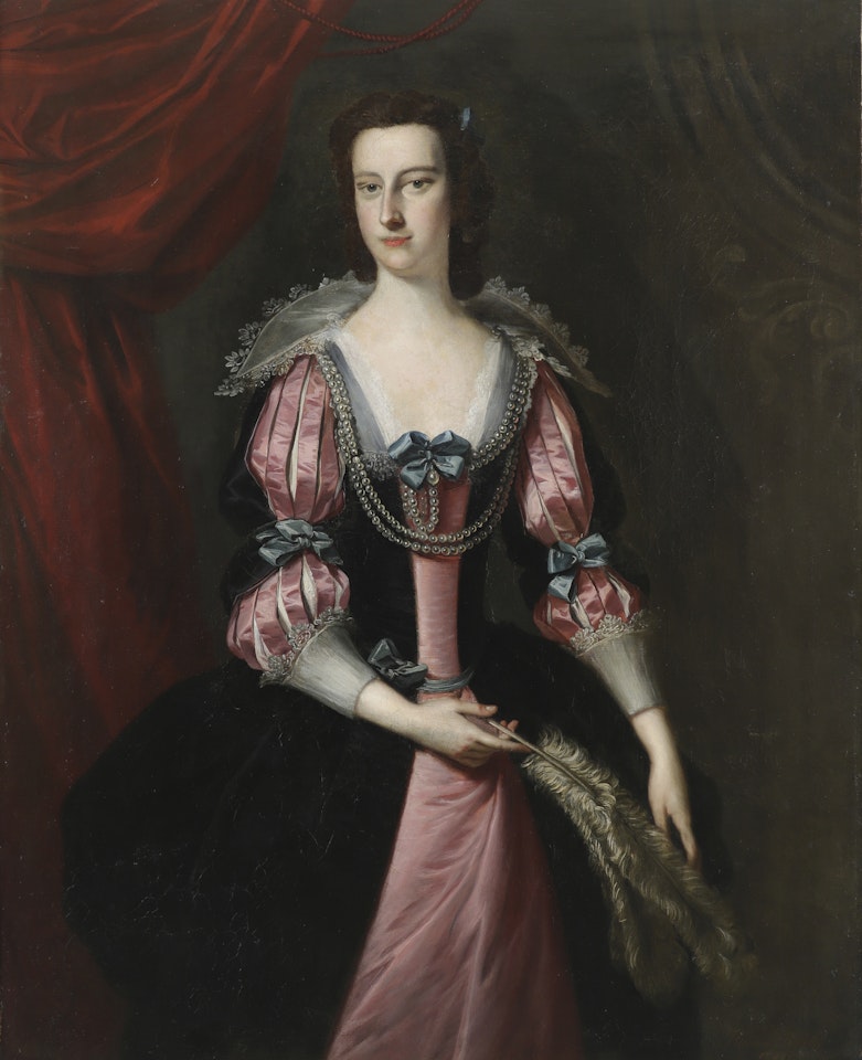 Portrait of a lady, three-quarter length in a pink and black dress holding ostrich feathers by Thomas Hudson