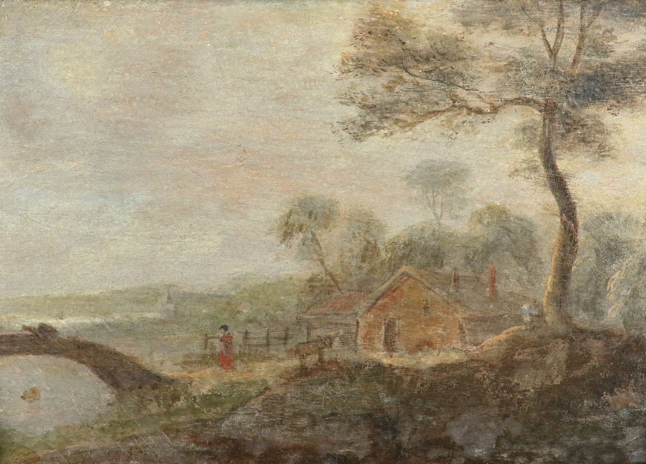 River landscape with a cottage and a figure by a bridge by English School