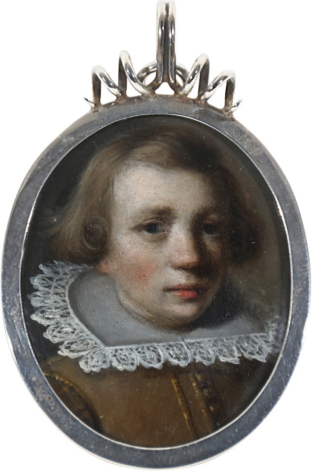 Portrait miniature of a young boy, wearing a buff coat and lace collar by Dutch School