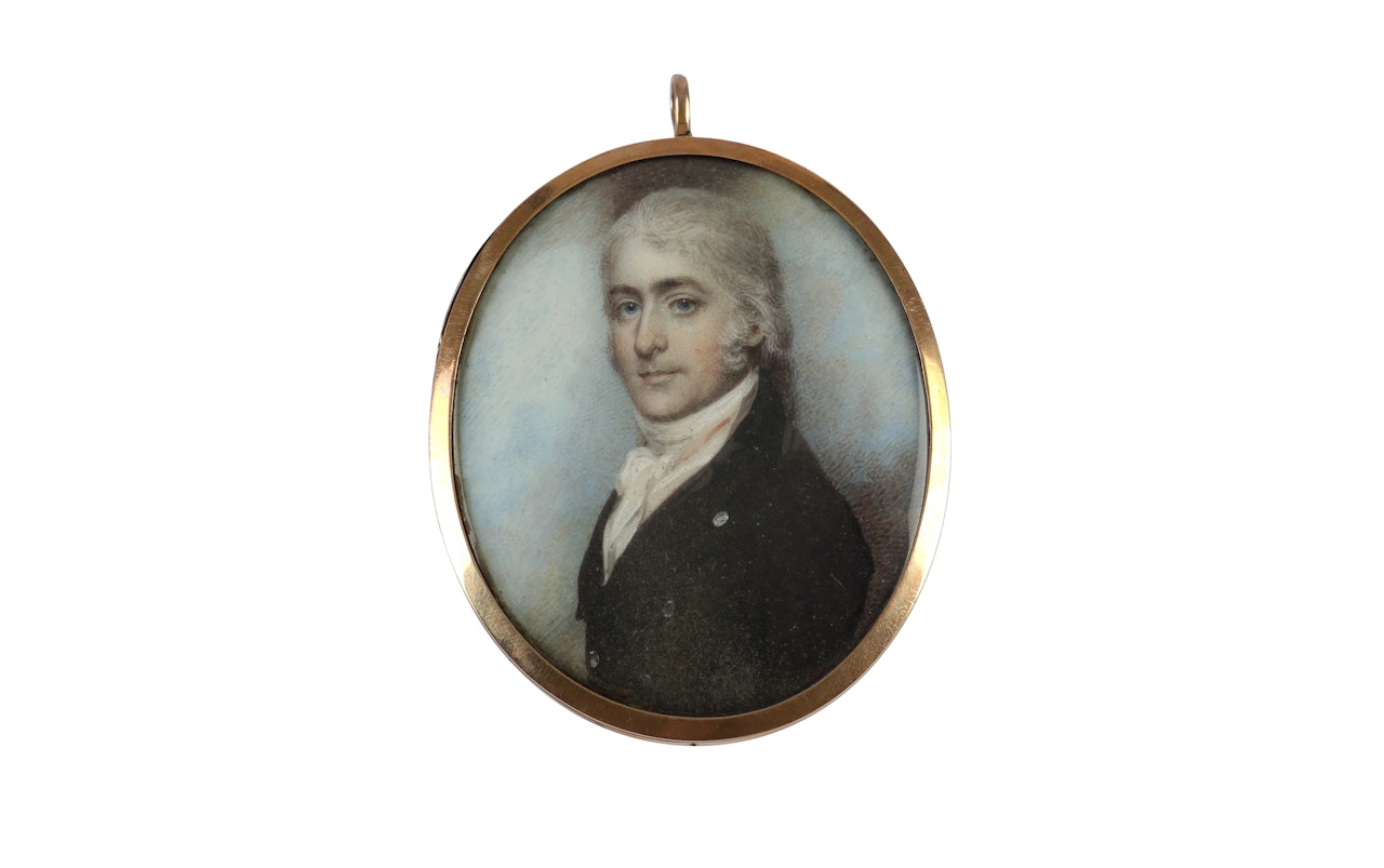 Portrait miniature of a gentleman in black coat and white stock by English School