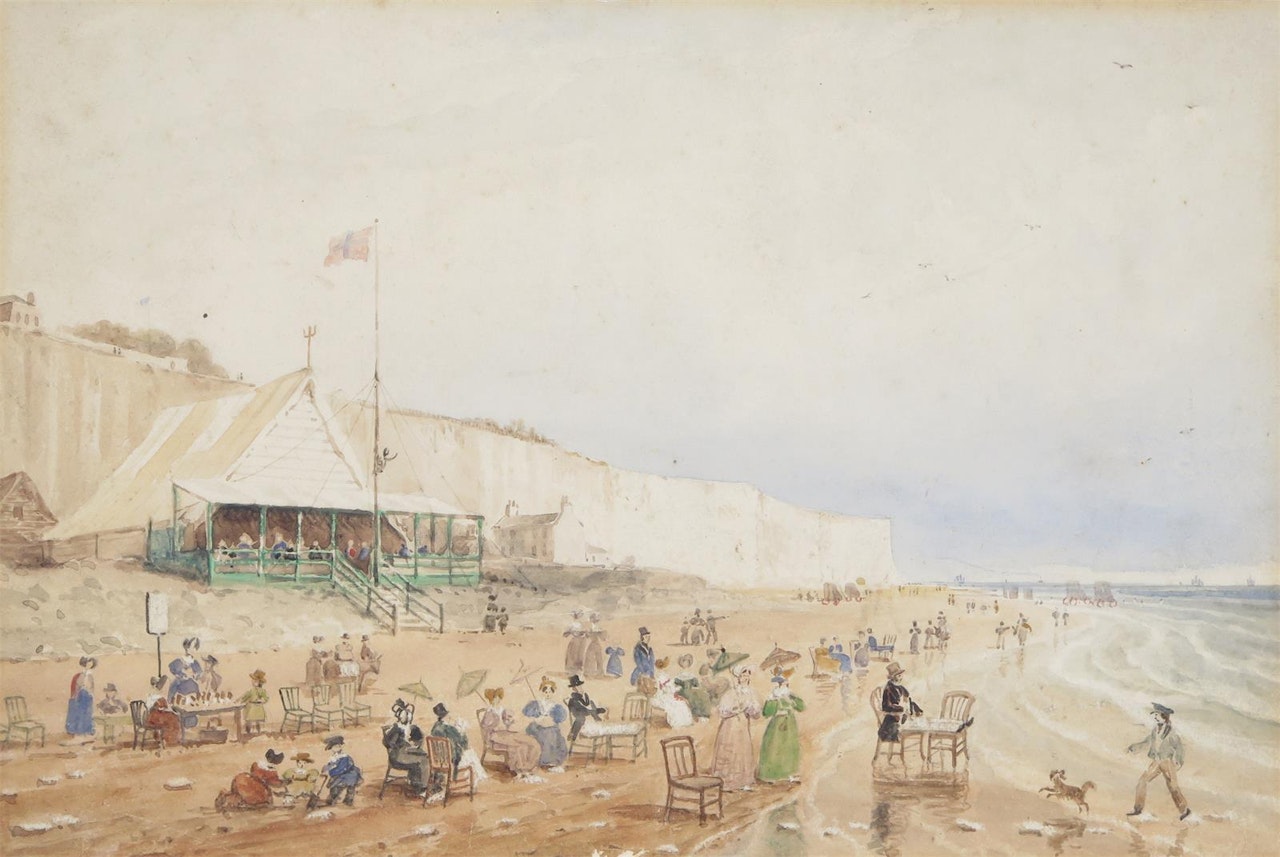 A busy beach scene by white cliffs by English School