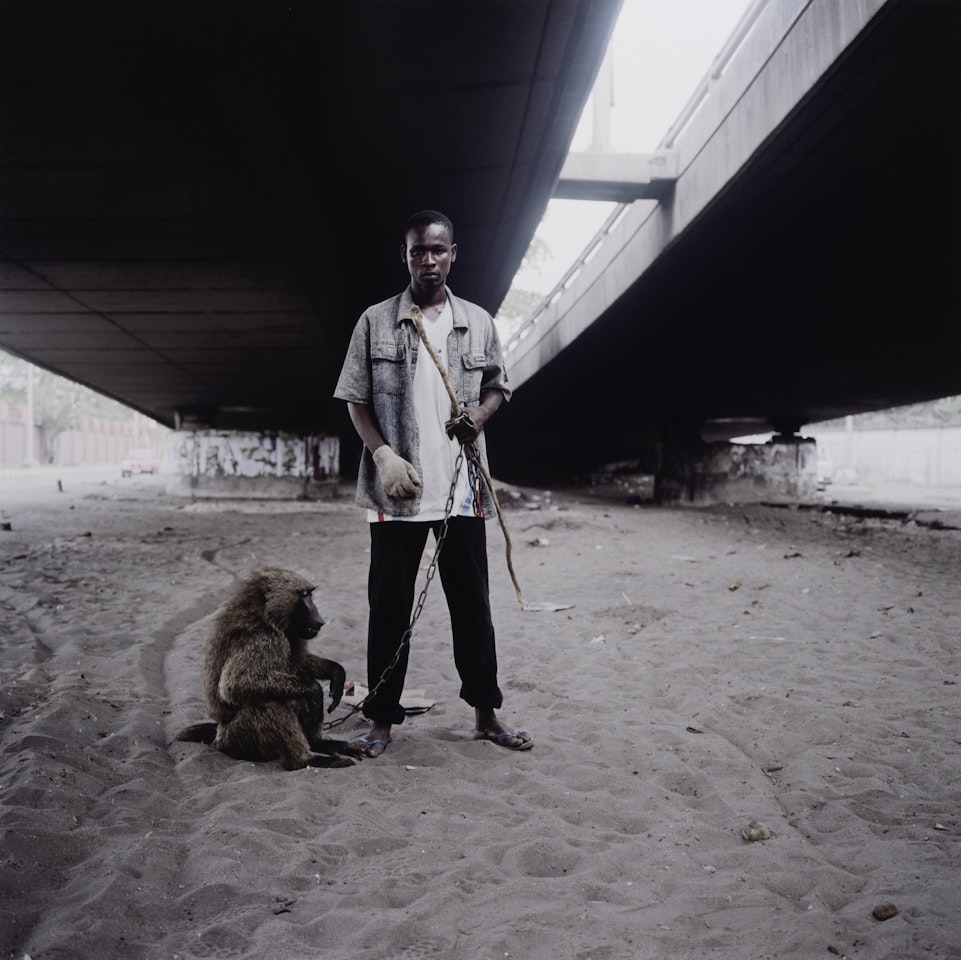 "Animal Handler with Ajasco, Lagos, Nigeria" (from "Hyena & Other Men") by Pieter Hugo