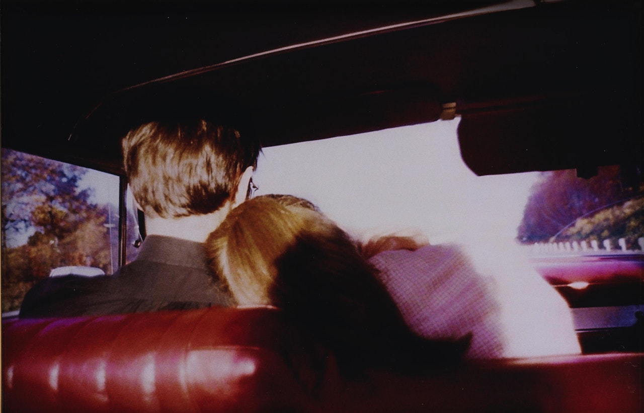 "Kim + Mark in my red car, Newton. MA." by Nan Goldin