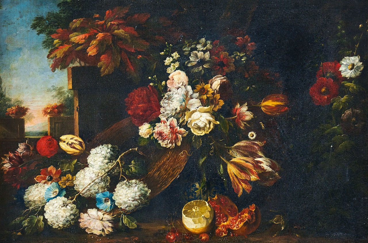 A rich flower still life with a lemon and pomegranate with a landscape beyond by Gasparo Lopez