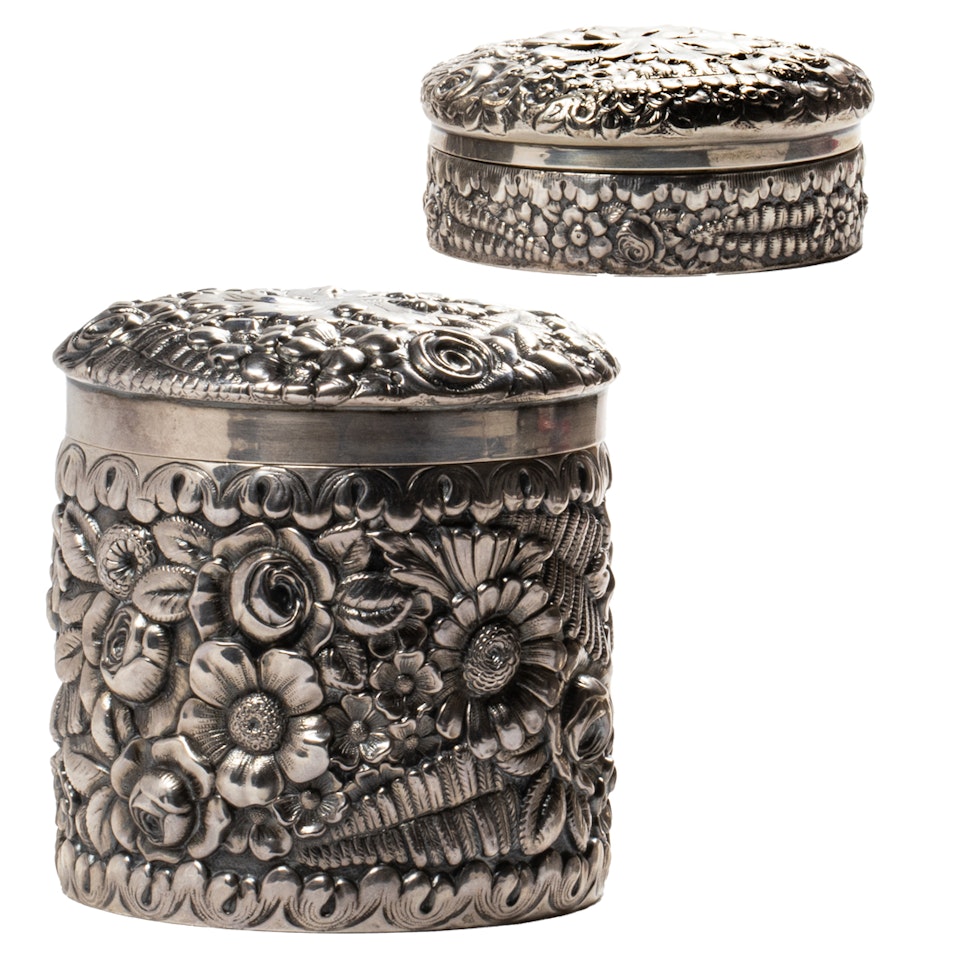 Two Tiffany & Co. Aesthetic Movement floral repousse sterling dresser jars by Tiffany & Co.