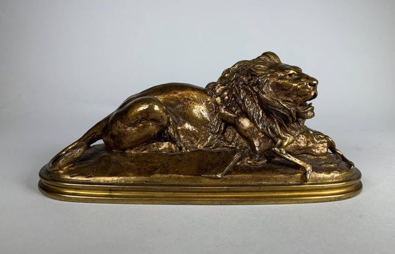 Lion devouring a bushbuck by Antoine-Louis Barye