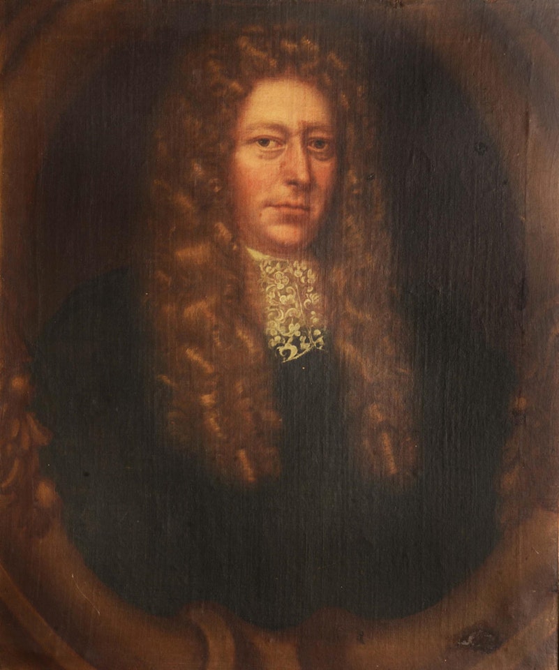 Portrait of a gentleman wearing a long curly wig and lace cravat within an oval cartouche by English School