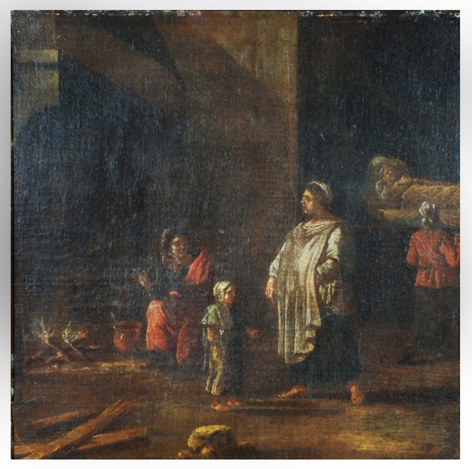 Figures in an interior warming themselves by a fire by Dutch School