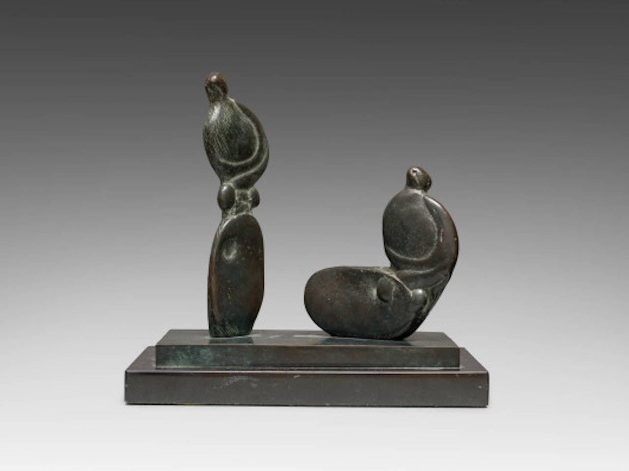 Seated and standing figures by Henry Moore