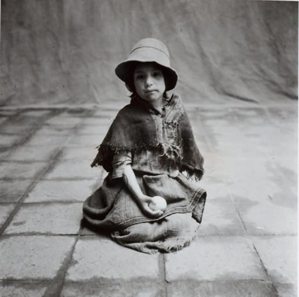 Christmas at Cuzco, "Beggar girl holding a precious orange" by Irving Penn