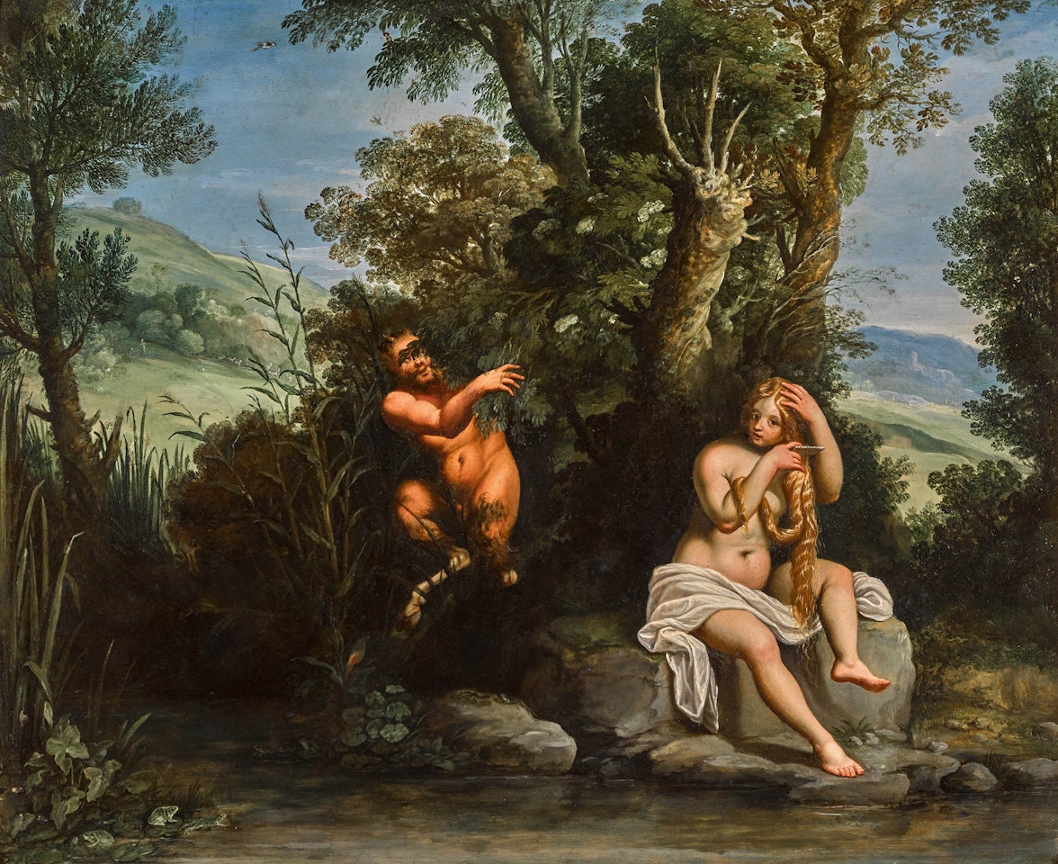 A wooded landscape with a satyr observing a bathing nymph by Paul Bril