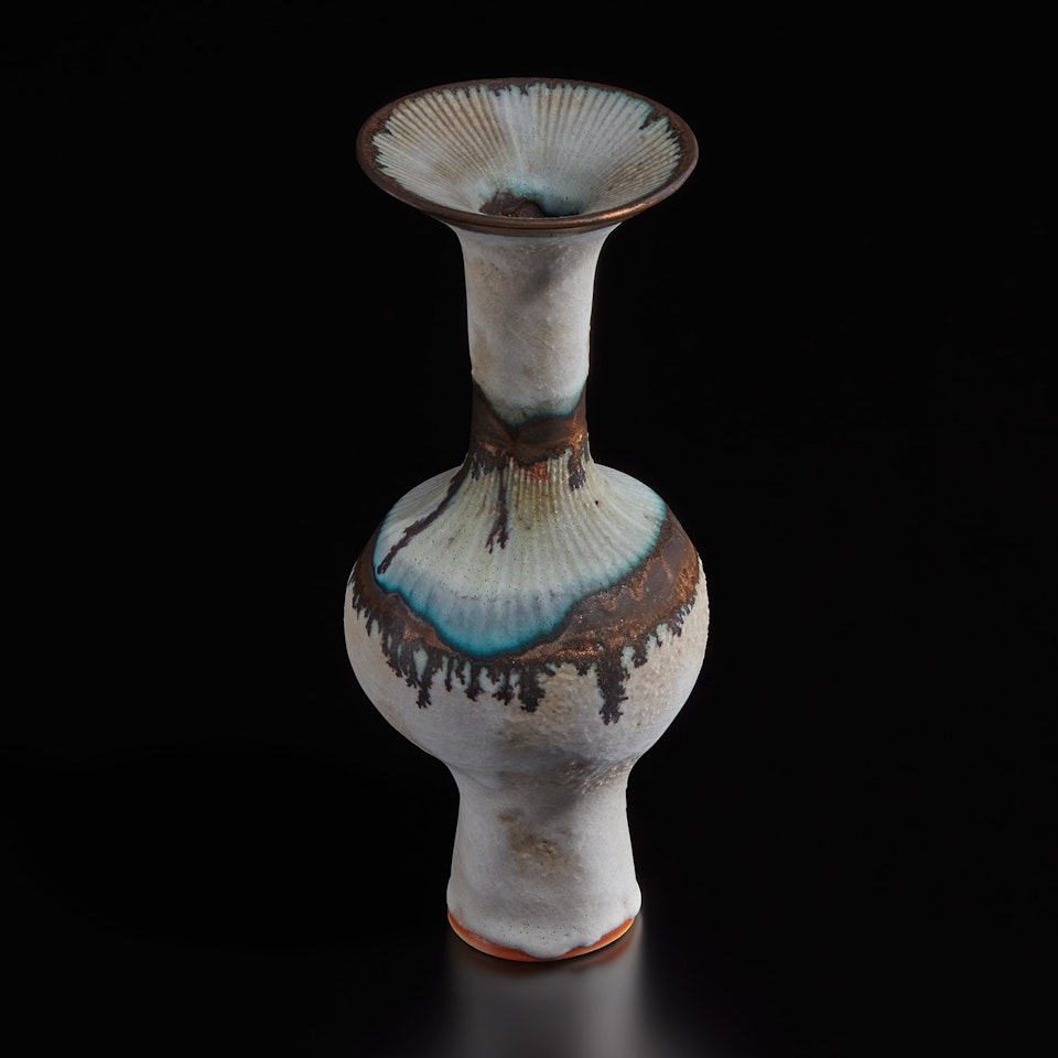 Bottle vase with flaring lip by Lucie Rie