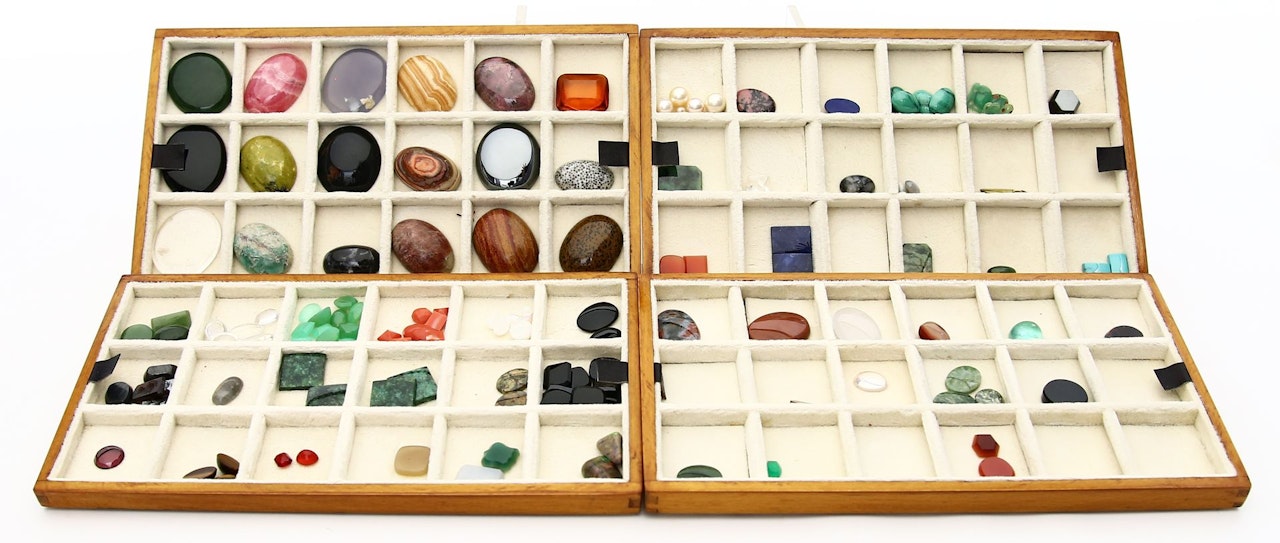 Collection of table stones and cabochons in a wrought iron casket by Unknown Jewelry Maker