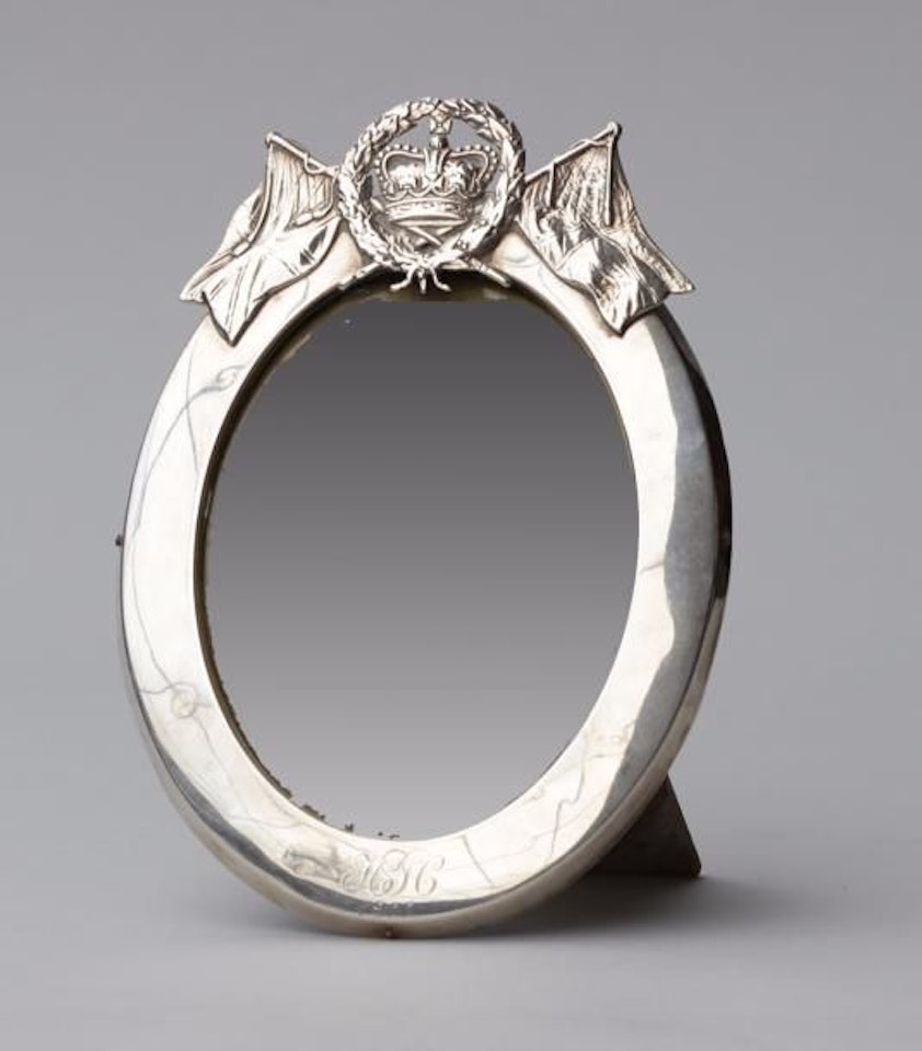 Oval-shaped PHOTO FRAME decorated with a embossed silver leaf by Unknown Jewelry Maker
