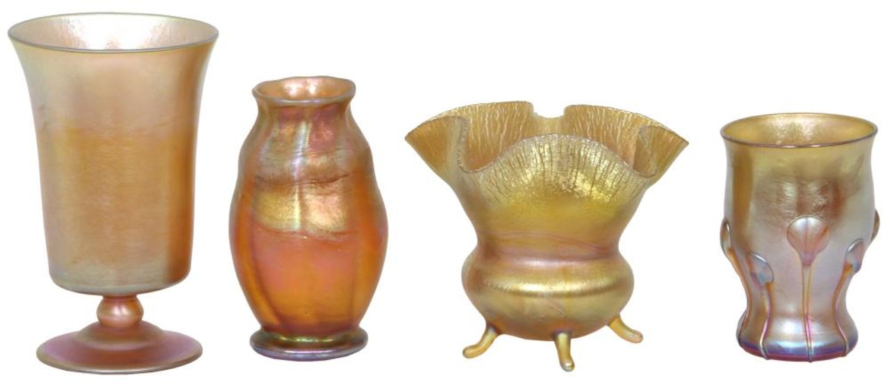 Favrile glass cabinet pieces having by Tiffany Studios