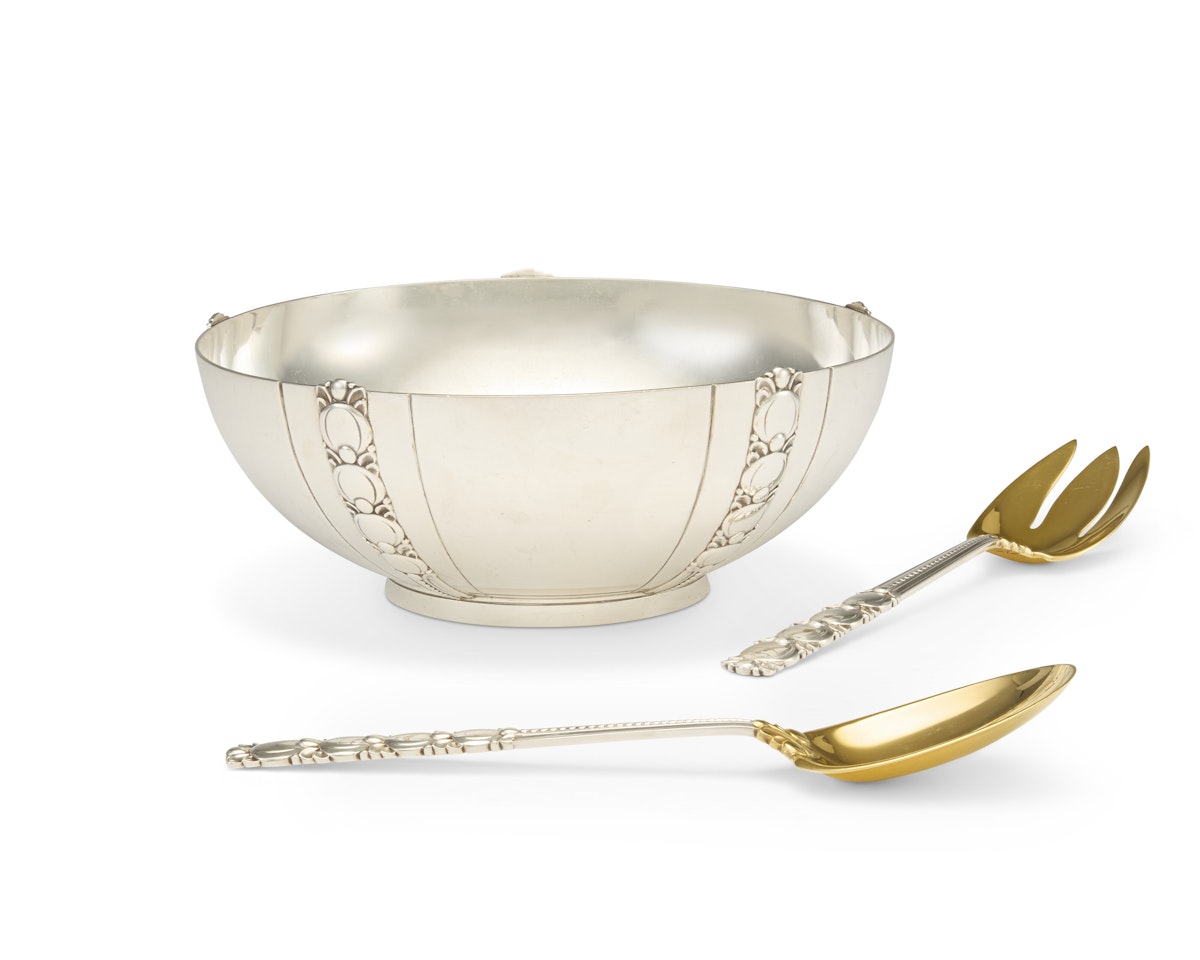 AN AMERICAN SILVER SALAD BOWL AND PAIR OF PARCEL-GILT SALAD SERVERS by Tiffany & Co.