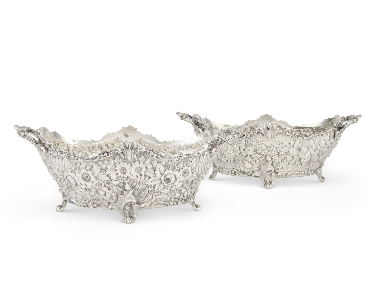 A NEAR PAIR OF AMERICAN SILVER TWO-HANDLED LARGE SWEETMEAT BASKETS by Tiffany & Co.