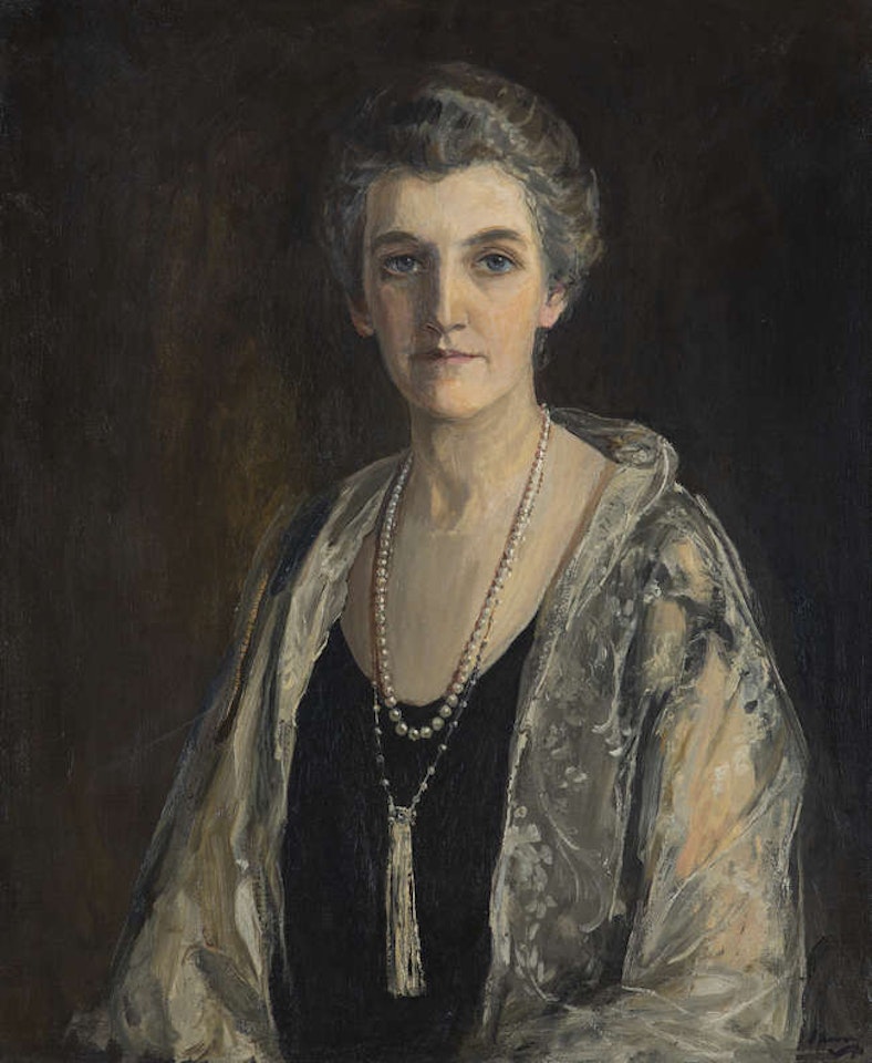 Mrs. J.F. McGuire - a Half Length Portrait Wearing a Black Dress, Lace Shawl and Pearls by John Lavery