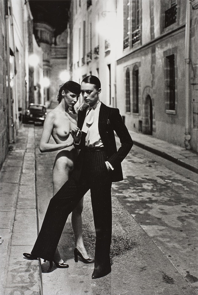 Yves St. Laurent"s Man"s Suit and Model Wearing Madame Paulette"s Creation, Rue Aubriot, Paris 4ème ardt., Summer ( by Helmut Newton
