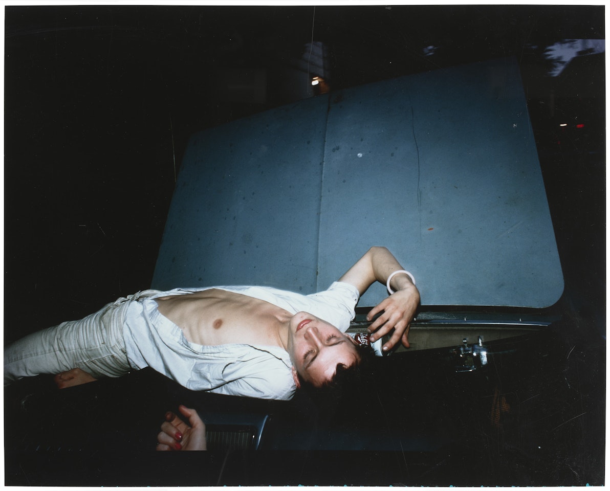 French Chris on convertible, NYC by Nan Goldin