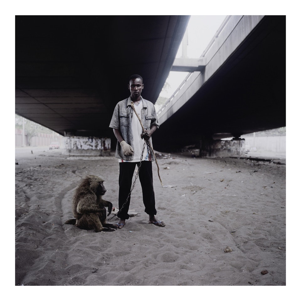 "Animal Handler with Ajasco, Lagos, Nigeria" (from "Hyena & Other Men") by Pieter Hugo