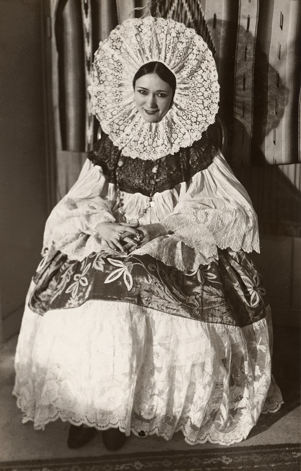 Woman in traditional attire by André Kertész