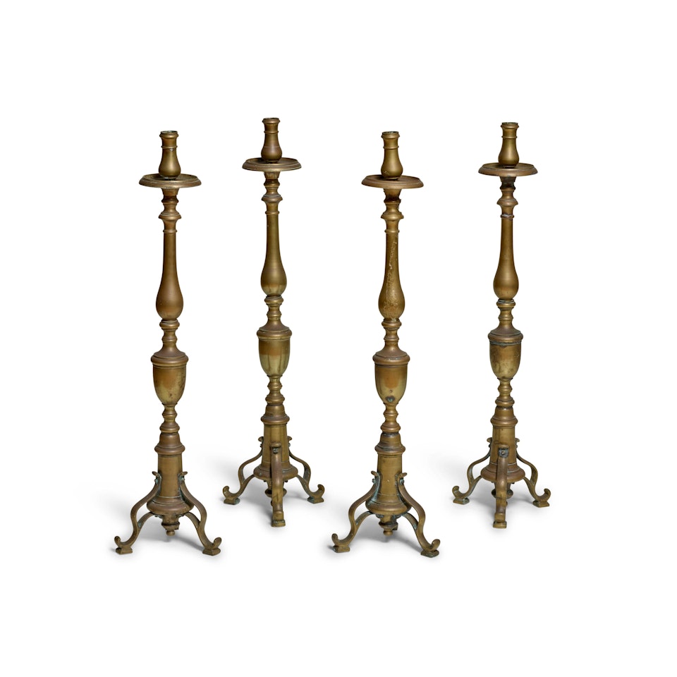 A SET OF FOUR BAROQUE STYLE BRASS ALTAR STICKS by Unknown (Baroque style)