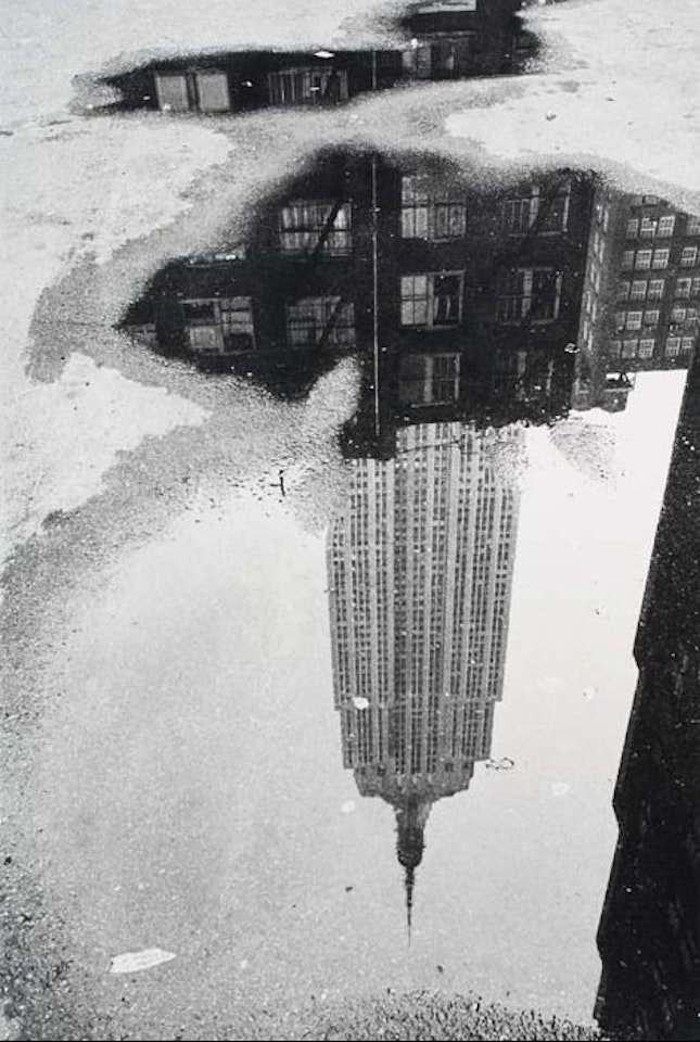 Puddle, New York. by André Kertész