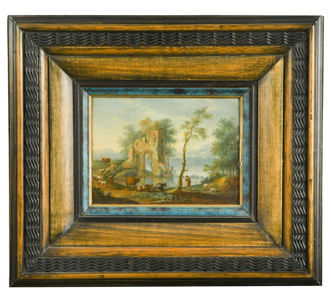 Cattle in a landscape near ruins and a lake beyond by Flemish School