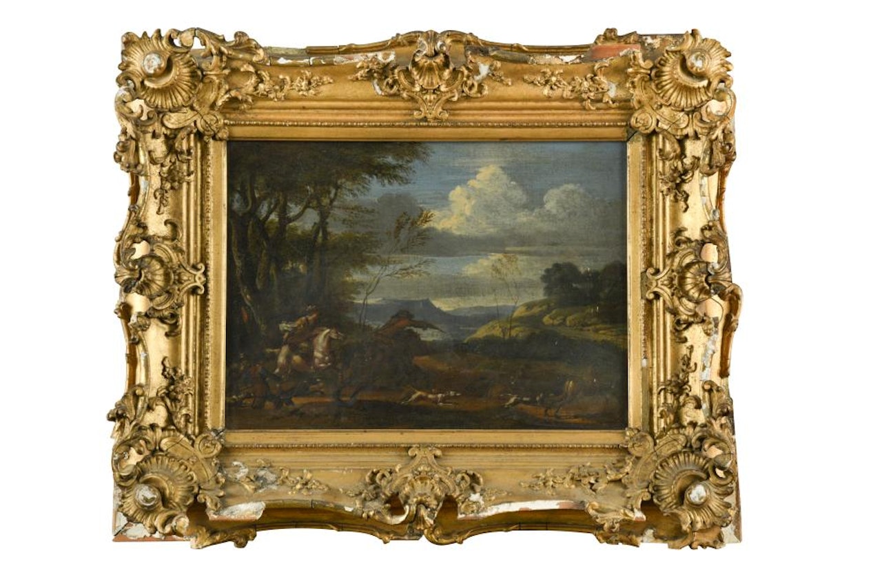 A lady and gentleman on horseback stag hunting on the edge of a wood in a mountainous landscape by Italian School