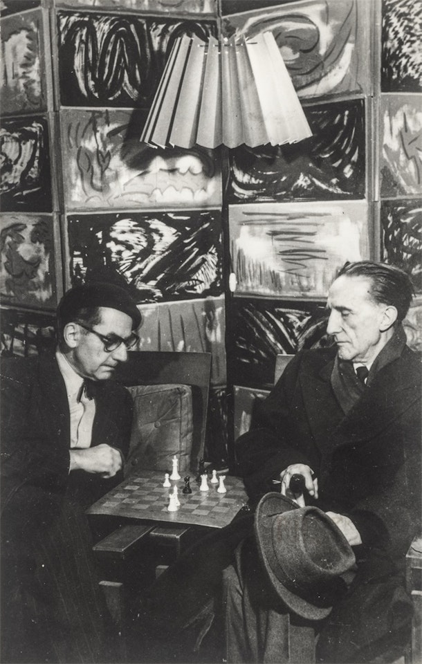 Man Ray and Marcel Duchamp playing chess in Man Ray"s studio on Rue Férou, Paris by Man Ray