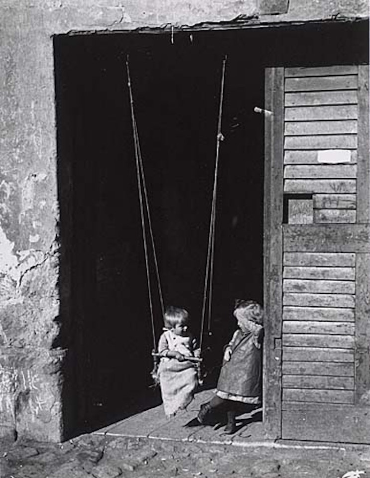 Children in a doorway, Esztergom, Hungary by André Kertész