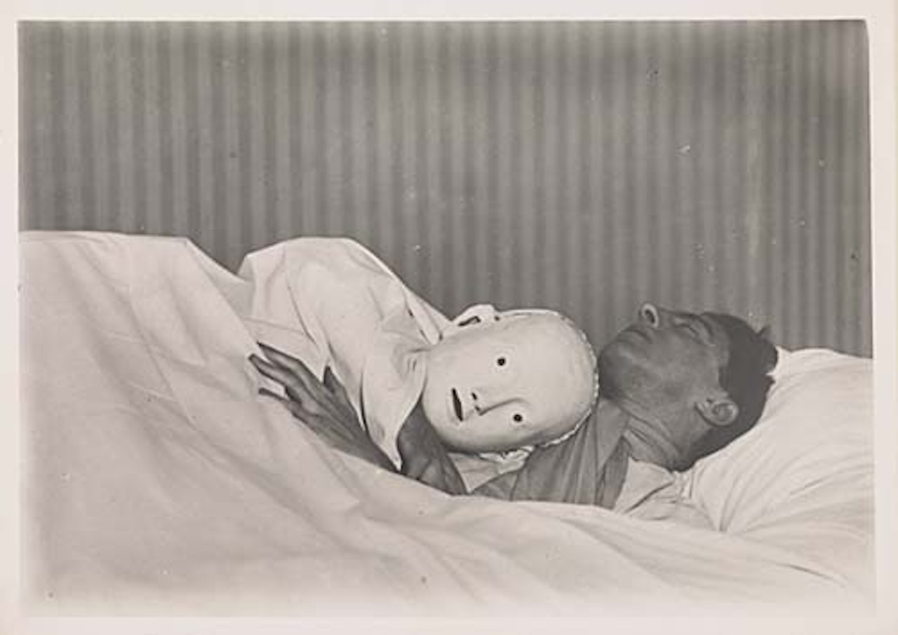 Jean Cocteau with mask by Berenice Abbott