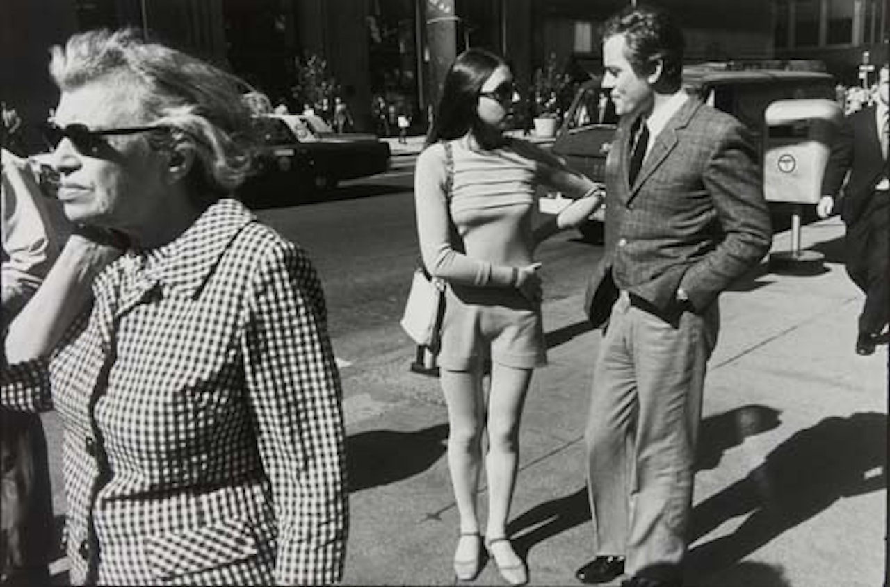 Untitled (Couple talking on the street) by Garry Winogrand